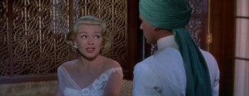 Movie still from “The Rains of Ranchipur” (1955), directed by Jean Negulesco – A man and a woman talking to each other; Close Up shot, Over the shoulder angle