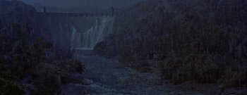 Movie still from “The Rains of Ranchipur” (1955), directed by Jean Negulesco – A view of a river with a waterfall in the background; Extreme Wide shot, High angle