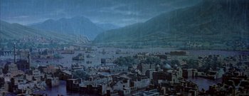 Movie still from “The Rains of Ranchipur” (1955), directed by Jean Negulesco – A painting of a city with a lake in the background; Extreme Wide shot, High angle