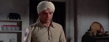 Movie still from “The Rains of Ranchipur” (1955), directed by Jean Negulesco – A man with a turban on his head; Close Up shot, Low angle