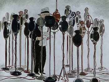 Movie still from “The Reluctant Dragon” (1941), directed by Jack Cutting – A man standing in front of a bunch of speakers; Medium shot, High angle