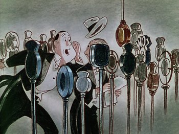 Movie still from “The Reluctant Dragon” (1941), directed by Jack Cutting – A group of people that are standing in front of a microphone; Medium shot, Low angle