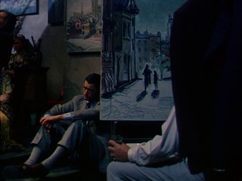 Movie still from “The Snows of Kilimanjaro” (1952), directed by Henry King – A man sitting in front of a painting; Wide shot, Over the shoulder angle