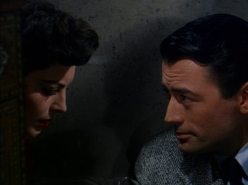 Movie still from “The Snows of Kilimanjaro” (1952), directed by Henry King – A man and a woman looking at one another; Close Up shot, High angle