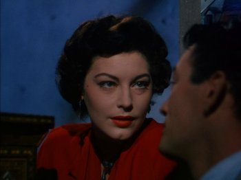 Movie still from “The Snows of Kilimanjaro” (1952), directed by Henry King – A man and a woman looking into each others eyes; Close Up shot, Over the shoulder angle