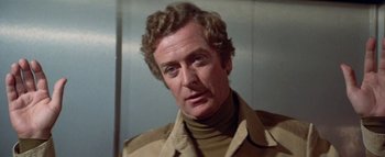 Movie still from “The Swarm” (1978), directed by Irwin Allen – A person wearing a jacket; Close Up shot, Over the shoulder angle