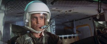 Movie still from “The Swarm” (1978), directed by Irwin Allen – A person wearing a helmet; Close Up shot, Low angle