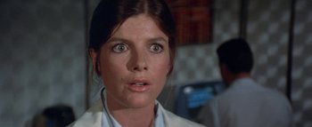 Movie still from “The Swarm” (1978), directed by Irwin Allen – A person wearing a lab coat; Close Up shot, Low angle