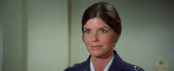 Movie still from “The Swarm” (1978), directed by Irwin Allen – A person wearing a uniform; Close Up shot, Low angle