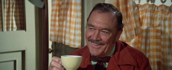 Movie still from “The Swarm” (1978), directed by Irwin Allen – An older man holding a coffee cup in his hand; Close Up shot, High angle