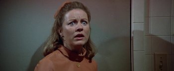 Movie still from “The Swarm” (1978), directed by Irwin Allen – A person wearing a jacket; Close Up shot, High angle