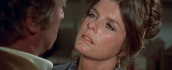 Movie still from “The Swarm” (1978), directed by Irwin Allen – A woman's face as a man looks on; Close Up shot, Over the shoulder angle