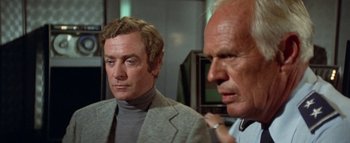 Movie still from “The Swarm” (1978), directed by Irwin Allen – A man and a woman looking at one another; Close Up shot, Over the shoulder angle