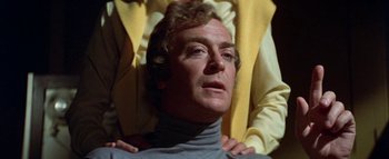 Movie still from “The Swarm” (1978), directed by Irwin Allen – A person wearing a sweater; Close Up shot, Over the shoulder angle