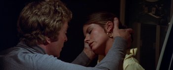 Movie still from “The Swarm” (1978), directed by Irwin Allen – A woman putting her head on another woman's head; Close Up shot, Over the shoulder angle