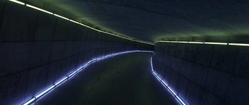 Movie still from “The Truth About Charlie” (2002), directed by Jonathan Demme – A tunnel that has lights on the side of it; Extreme Wide shot, High angle