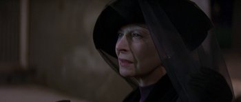 Movie still from “The Truth About Charlie” (2002), directed by Jonathan Demme – An older woman wearing a black hat and a black veil; Close Up shot, Low angle
