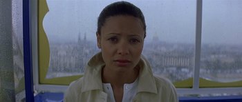 Movie still from “The Truth About Charlie” (2002), directed by Jonathan Demme – A person wearing a white shirt; Close Up shot, High angle