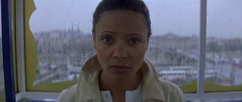 Movie still from “The Truth About Charlie” (2002), directed by Jonathan Demme – A person wearing a white jacket; Close Up shot, High angle