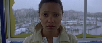 Movie still from “The Truth About Charlie” (2002), directed by Jonathan Demme – A person wearing a white jacket; Close Up shot, High angle