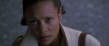 Movie still from “The Truth About Charlie” (2002), directed by Jonathan Demme – A woman's face in a white shirt; Close Up shot, High angle