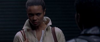 Movie still from “The Truth About Charlie” (2002), directed by Jonathan Demme – A person wearing a jacket; Close Up shot, Over the shoulder angle