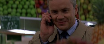Movie still from “The Truth About Charlie” (2002), directed by Jonathan Demme – A person talking on a cell phone; Close Up shot, Over the shoulder angle