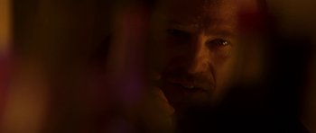 Movie still from “The Truth About Charlie” (2002), directed by Jonathan Demme – A man's face in the dark; Extreme Close Up shot, Over the shoulder angle