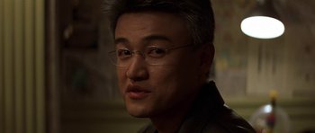 Movie still from “The Truth About Charlie” (2002), directed by Jonathan Demme – A person wearing glasses; Close Up shot, Over the shoulder angle