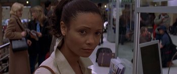 Movie still from “The Truth About Charlie” (2002), directed by Jonathan Demme – A person wearing a white shirt; Close Up shot, High angle