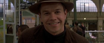 Movie still from “The Truth About Charlie” (2002), directed by Jonathan Demme – A person wearing a hat; Close Up shot, Low angle