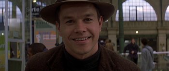 Movie still from “The Truth About Charlie” (2002), directed by Jonathan Demme – A person wearing a hat; Close Up shot, Over the shoulder angle