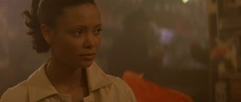 Movie still from “The Truth About Charlie” (2002), directed by Jonathan Demme – A person wearing a jacket; Close Up shot, Over the shoulder angle