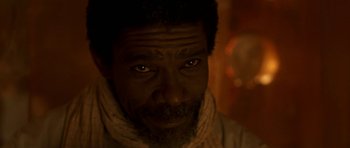 Movie still from “The Truth About Charlie” (2002), directed by Jonathan Demme – A person wearing a scarf; Close Up shot, Low angle