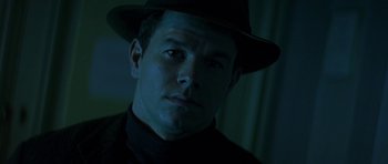 Movie still from “The Truth About Charlie” (2002), directed by Jonathan Demme – A person wearing a hat; Close Up shot, Low angle