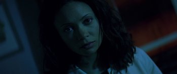 Movie still from “The Truth About Charlie” (2002), directed by Jonathan Demme – A person's face in the dark; Close Up shot, High angle