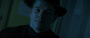 Movie still from “The Truth About Charlie” (2002), directed by Jonathan Demme – A person wearing a hat; Close Up shot, Low angle