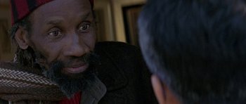 Movie still from “The Truth About Charlie” (2002), directed by Jonathan Demme – A person with a beard looking in the mirror; Close Up shot, Over the shoulder angle