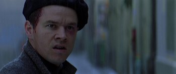 Movie still from “The Truth About Charlie” (2002), directed by Jonathan Demme – A person wearing a hat and looking at the camera; Close Up shot, Low angle