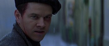 Movie still from “The Truth About Charlie” (2002), directed by Jonathan Demme – A person wearing a hat; Close Up shot, Low angle