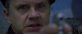 Movie still from “The Truth About Charlie” (2002), directed by Jonathan Demme – A man's face with water droplets on his face; Extreme Close Up shot, Low angle