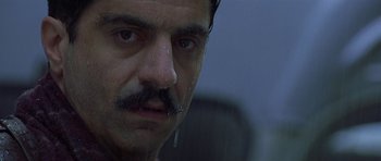 Movie still from “The Truth About Charlie” (2002), directed by Jonathan Demme – A person with a mustache; Close Up shot, Low angle