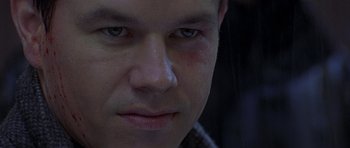 Movie still from “The Truth About Charlie” (2002), directed by Jonathan Demme – A man's face in the dark; Extreme Close Up shot, Low angle