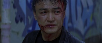Movie still from “The Truth About Charlie” (2002), directed by Jonathan Demme – A person with blood on his face; Close Up shot, Low angle