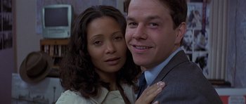 Movie still from “The Truth About Charlie” (2002), directed by Jonathan Demme – A man and a woman posing for a picture; Close Up shot, Low angle
