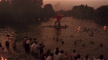 Movie still from “Time of the Gypsies” (1988), directed by Emir Kusturica – A group of people standing in a body of water; Extreme Wide shot, High angle