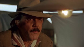 Movie still from “Time of the Gypsies” (1988), directed by Emir Kusturica – A person wearing a cowboy hat; Close Up shot, Low angle