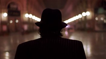 Movie still from “Time of the Gypsies” (1988), directed by Emir Kusturica – A man wearing a hat standing in the dark; Close Up shot, Low angle