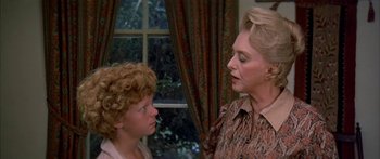Movie still from “Tom Sawyer” (1973), directed by Don Taylor – An older woman talking to a young boy in front of a window; Close Up shot, Over the shoulder angle