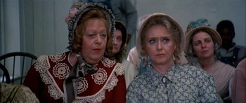 Movie still from “Tom Sawyer” (1973), directed by Don Taylor – Two older women dressed in period clothing and hats; Close Up shot, High angle